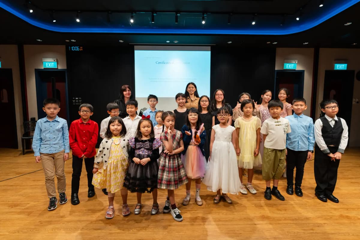 Violin ensemble performing on stage